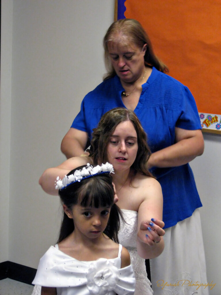 Mom doing Nani’s hair while Nani fixes thePinkDiva’s hair.