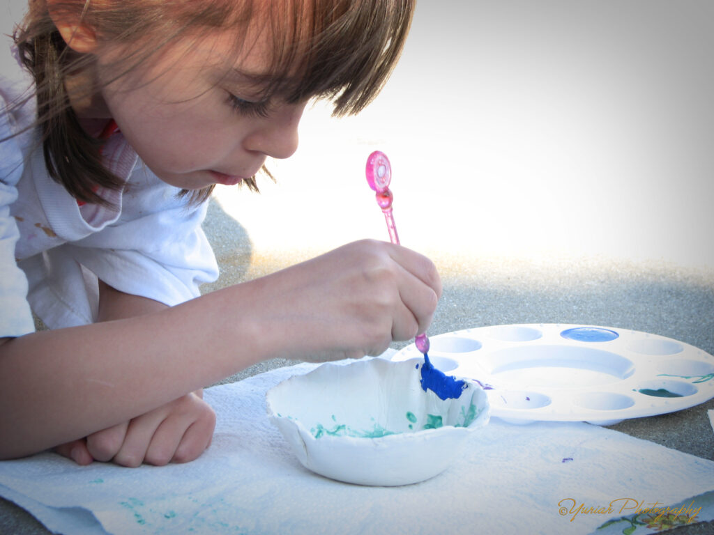 Painting her “Ming” bowl