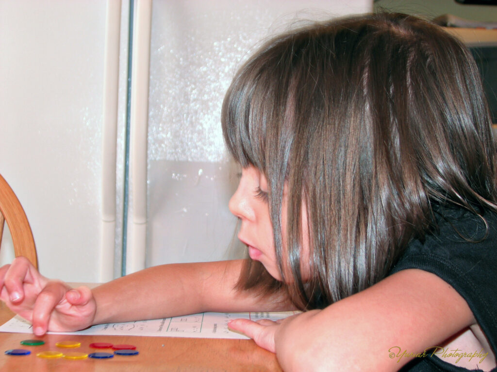 Using counters to check her numbers